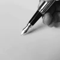Person holding fountain pen
